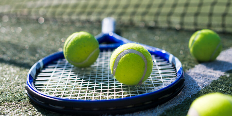 close-up-tennis-racket-balls_2